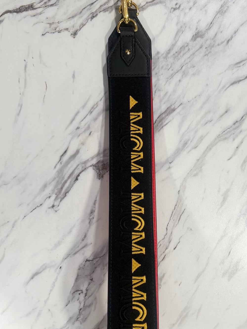 MCM Black Purse Strap with Gold Logo and Red Edge